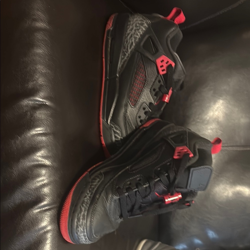 Black and Red Jordan spikes 6 y